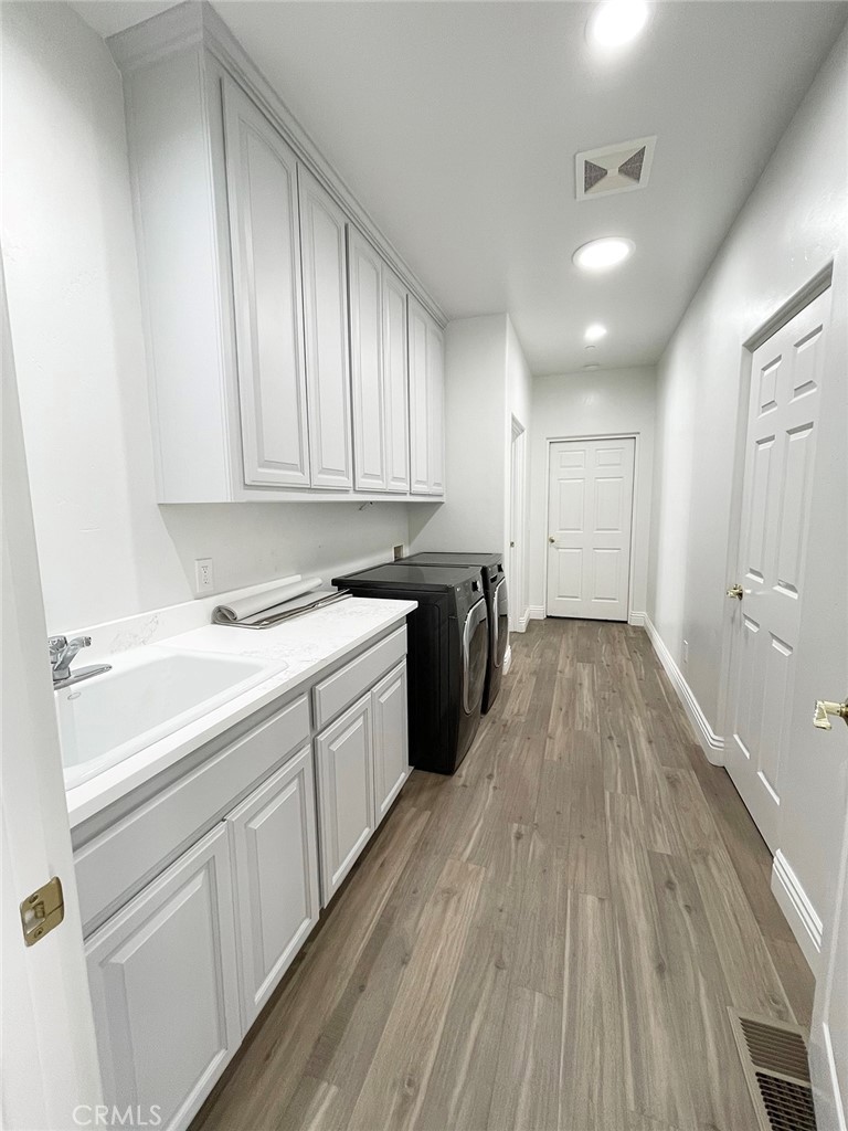 8560 Corriente Road Atascadero, CA 93422 - Photo 46 of 53 a kitchen with a sink window and cabinets