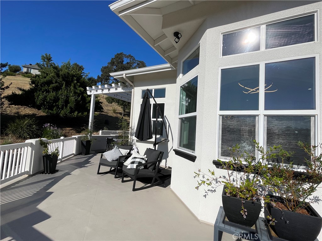 8560 Corriente Road Atascadero, CA 93422 - Photo 5 of 53 a view of a patio with couches table and chairs and potted plants