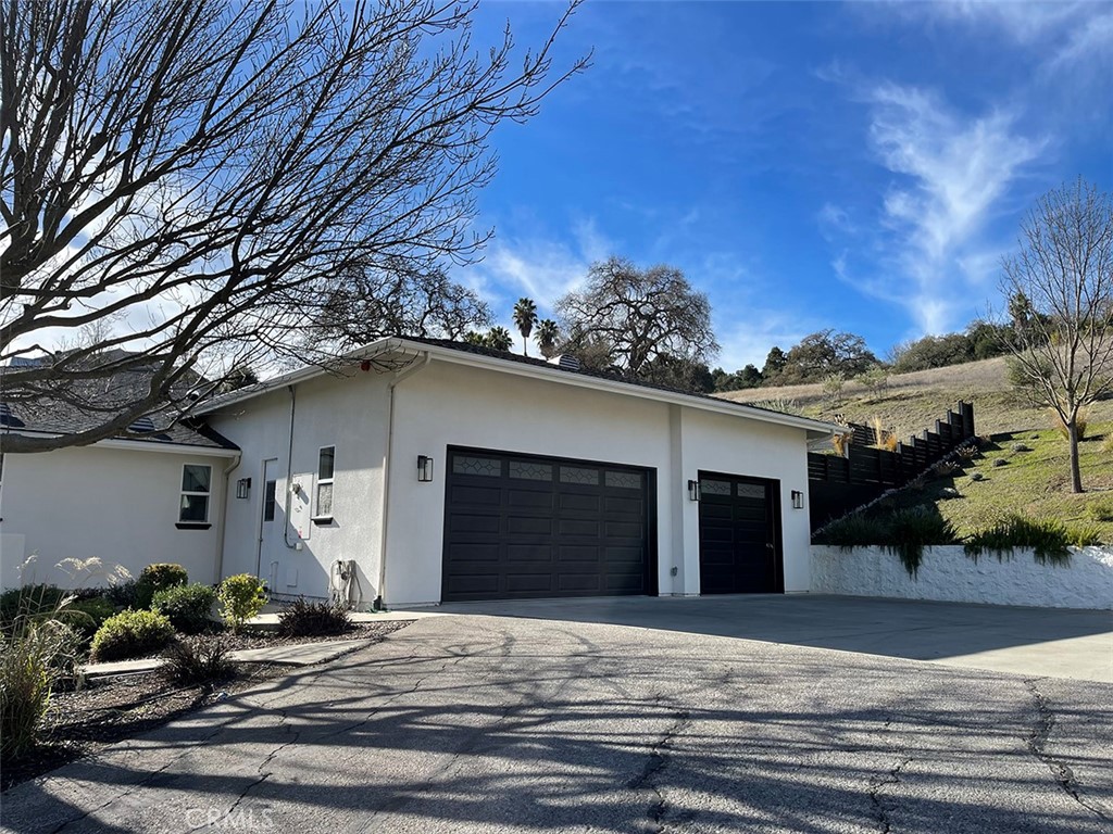8560 Corriente Road Atascadero, CA 93422 - Photo 8 of 53 a front view of a house with garden
