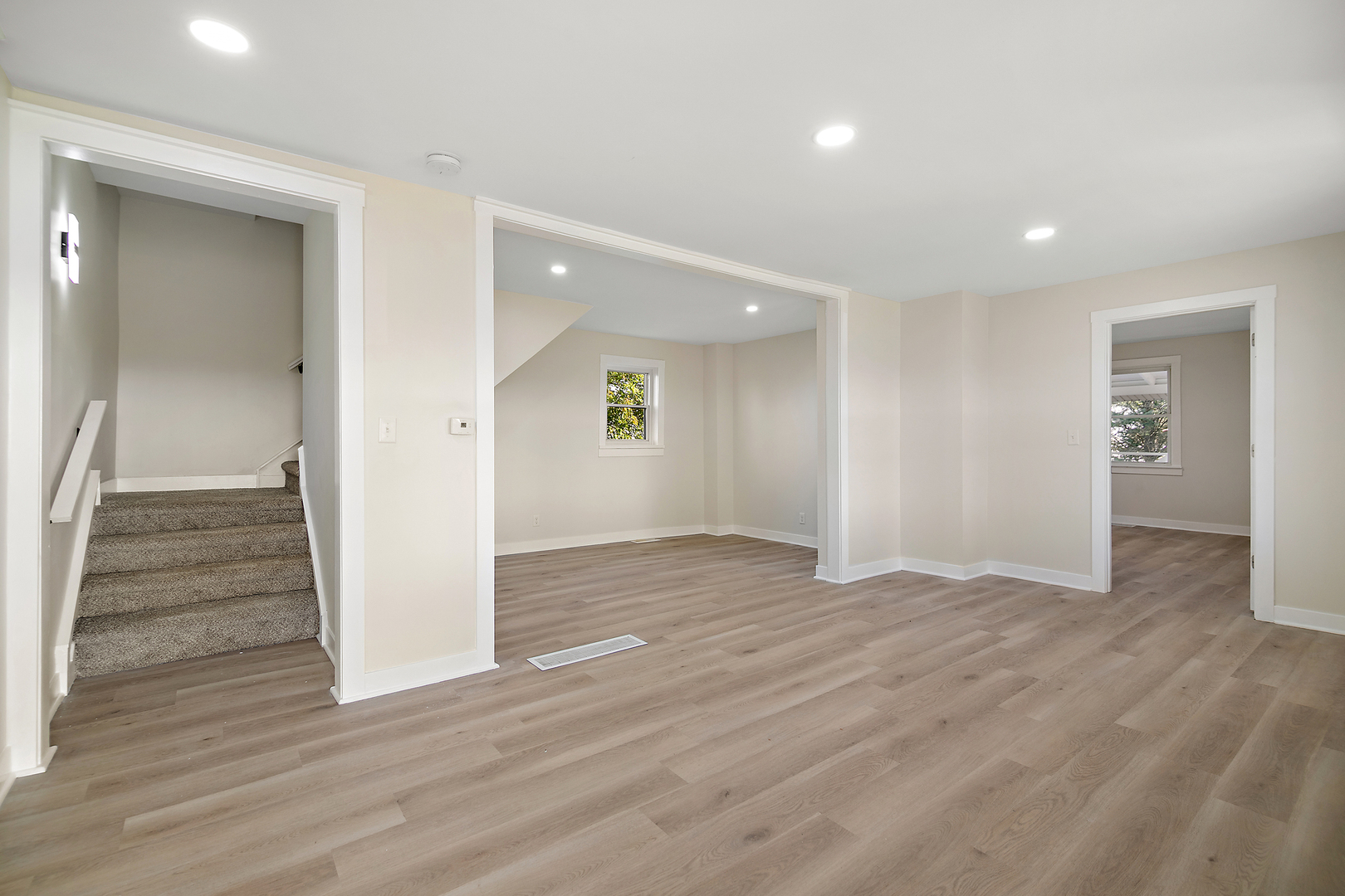 2773 North 900 East Road Ashkum, IL 60911 - Photo 9 of 30 an empty room with wooden floor & windows