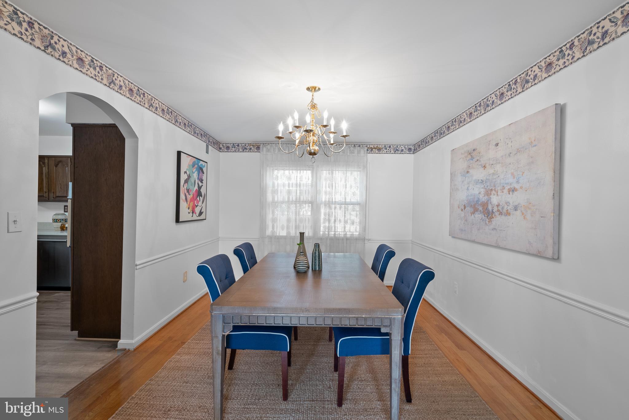 6726 Blanche Drive Lorton, VA 22079 - Photo 14 of 66 a view of a dining room with furniture and chandelier