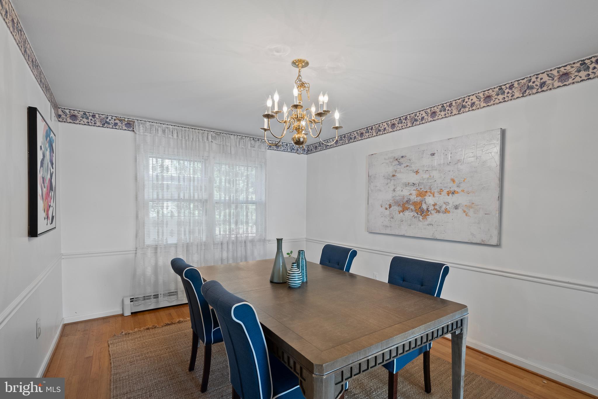 6726 Blanche Drive Lorton, VA 22079 - Photo 15 of 66 a view of a dining room with furniture and chandelier