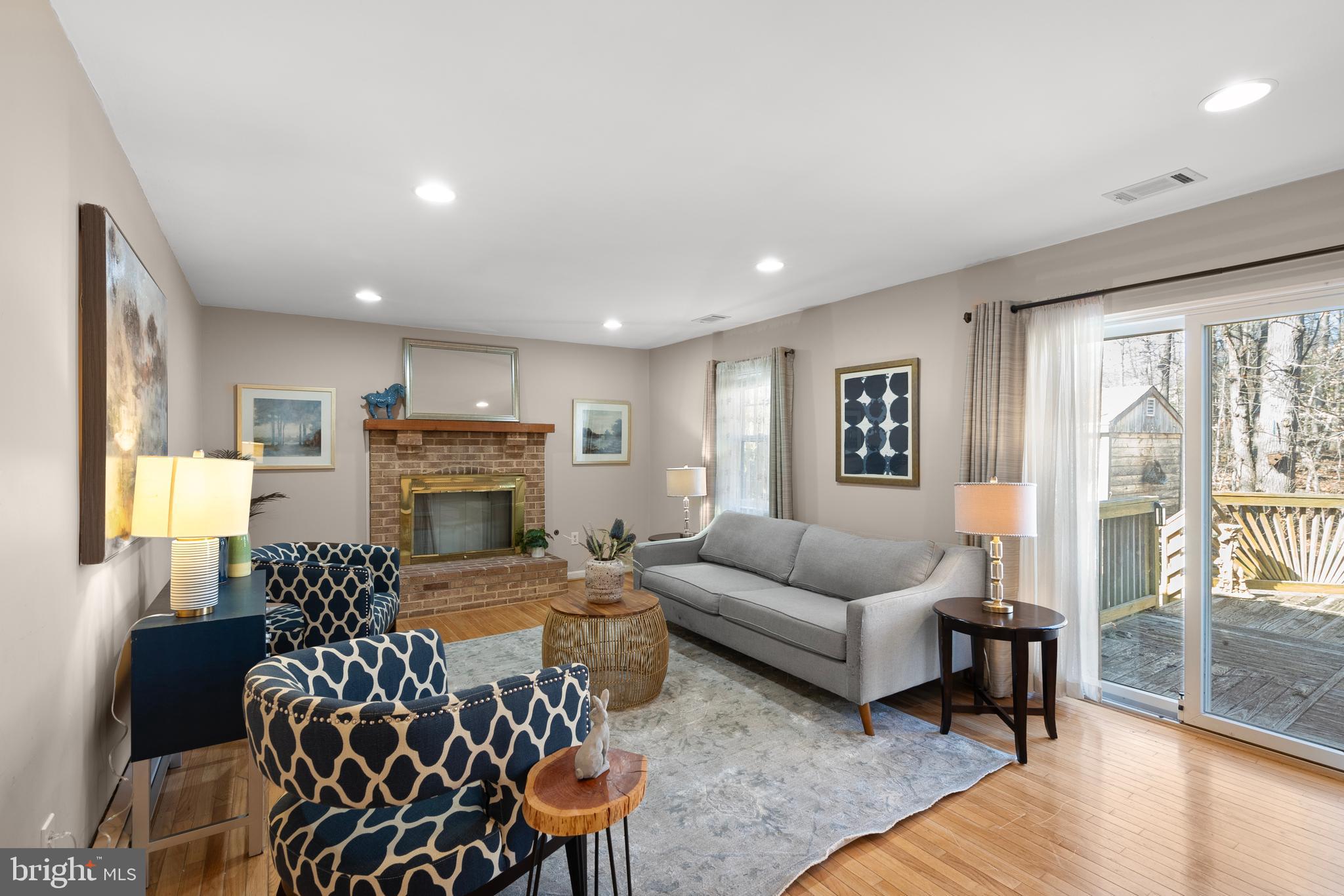 6726 Blanche Drive Lorton, VA 22079 - Photo 19 of 66 a living room with furniture a fireplace and a table