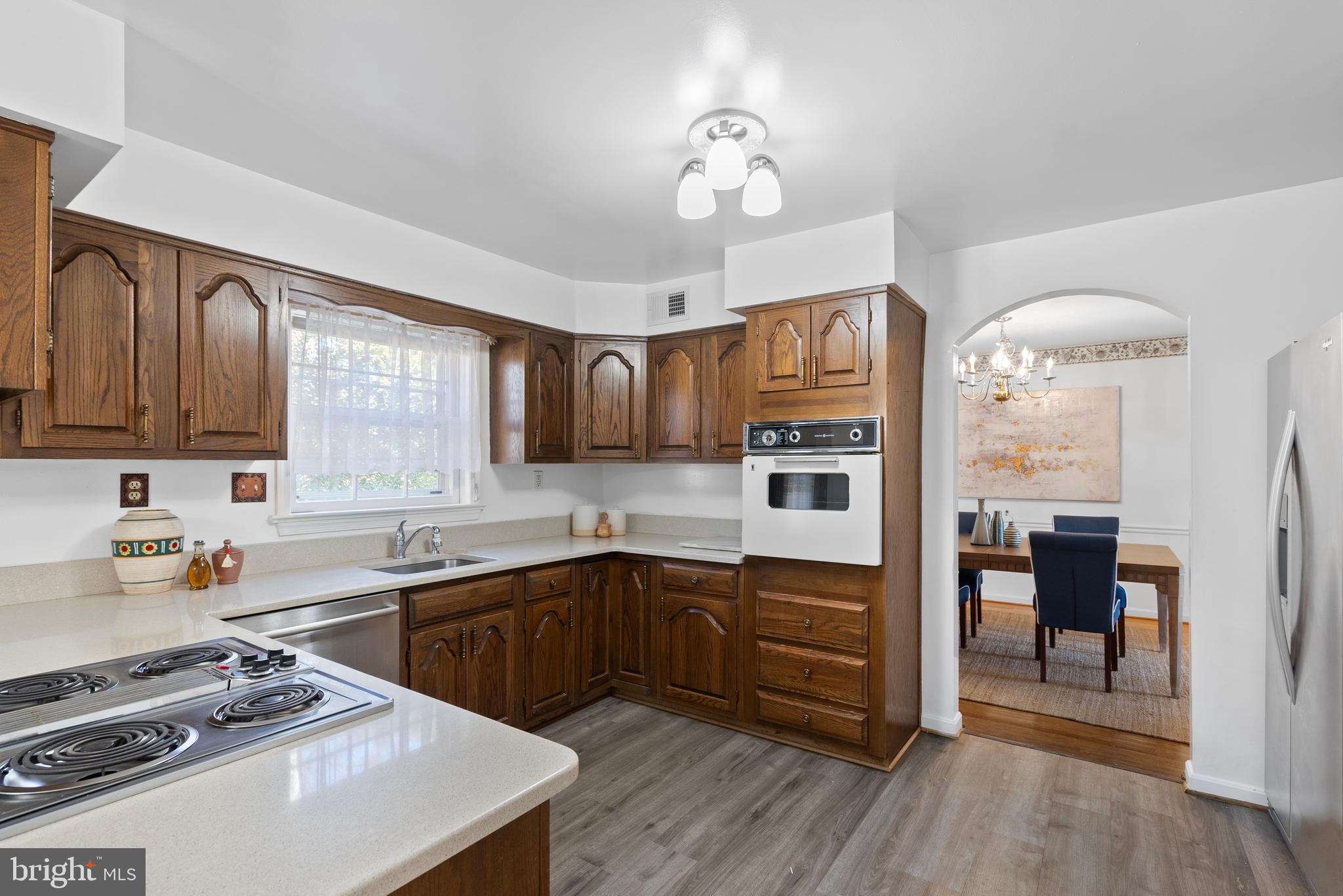 6726 Blanche Drive Lorton, VA 22079 - Photo 25 of 66 a kitchen with stainless steel appliances a sink stove and refrigerator