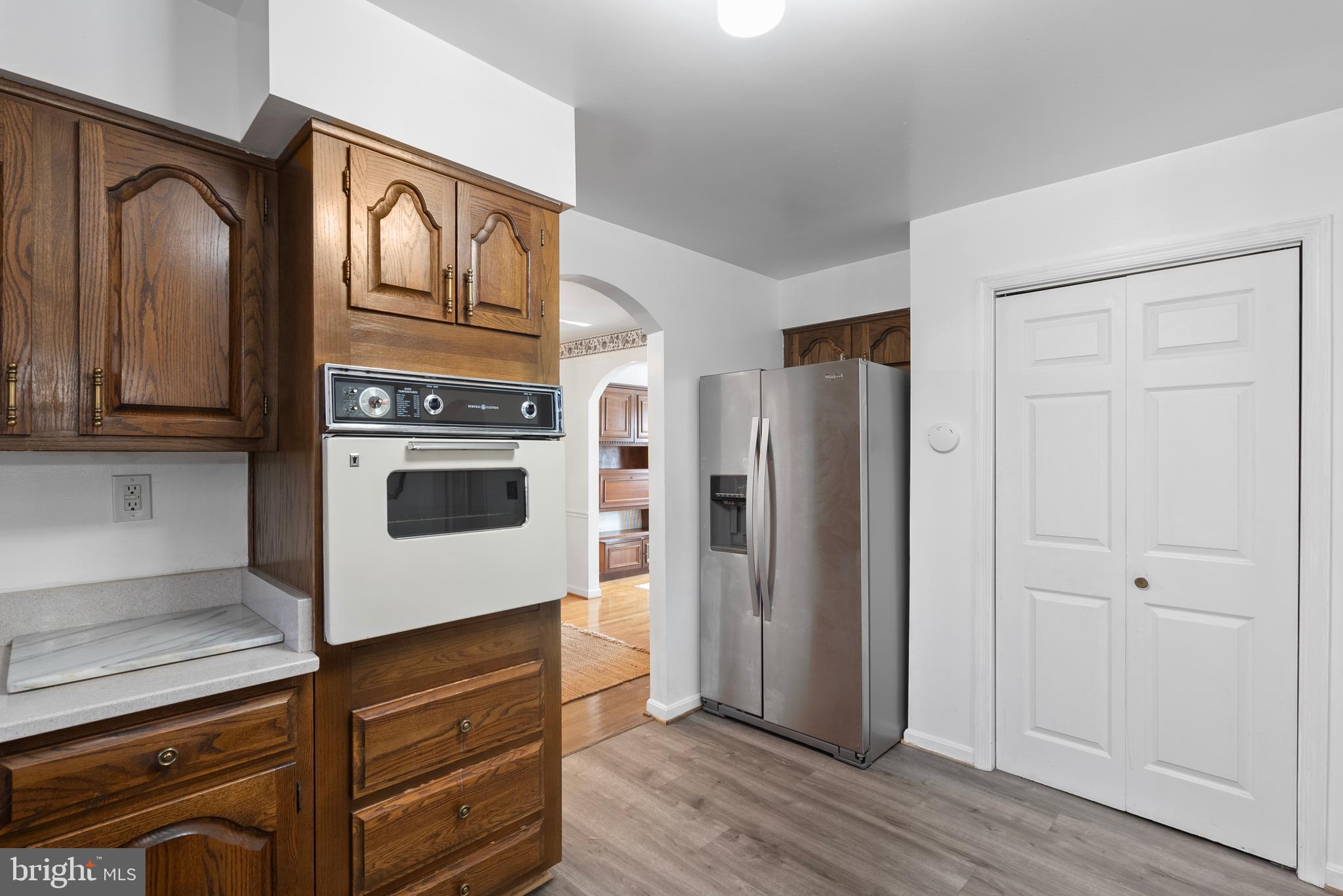 6726 Blanche Drive Lorton, VA 22079 - Photo 30 of 66 a kitchen with stainless steel appliances granite countertop a refrigerator and a stove top oven