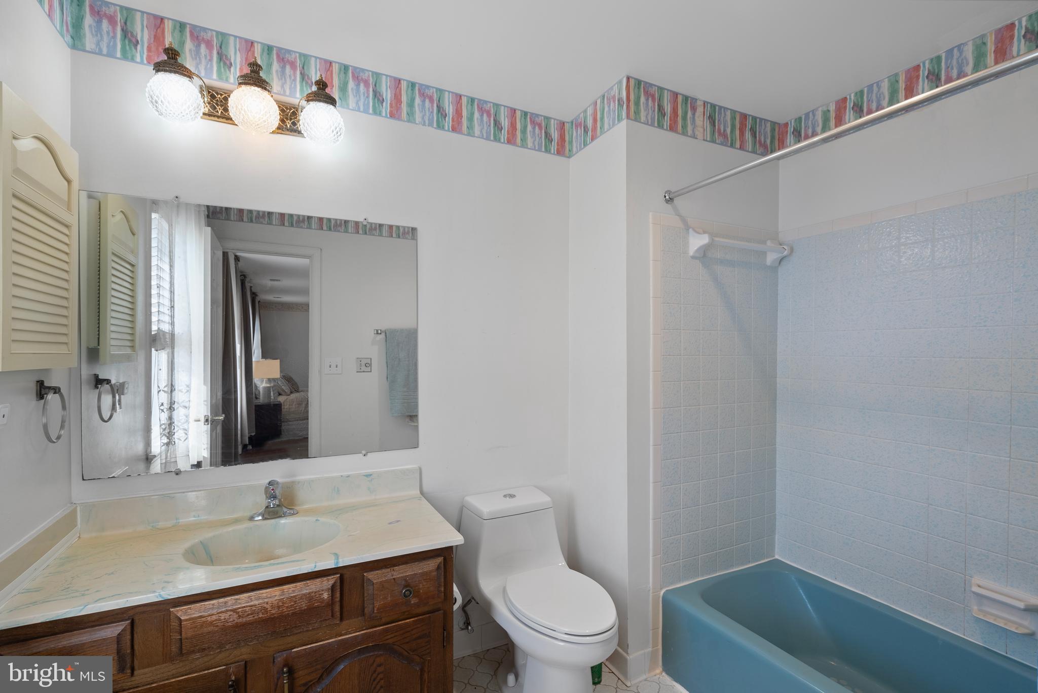 6726 Blanche Drive Lorton, VA 22079 - Photo 40 of 66 a bathroom with a sink toilet vanity and shower