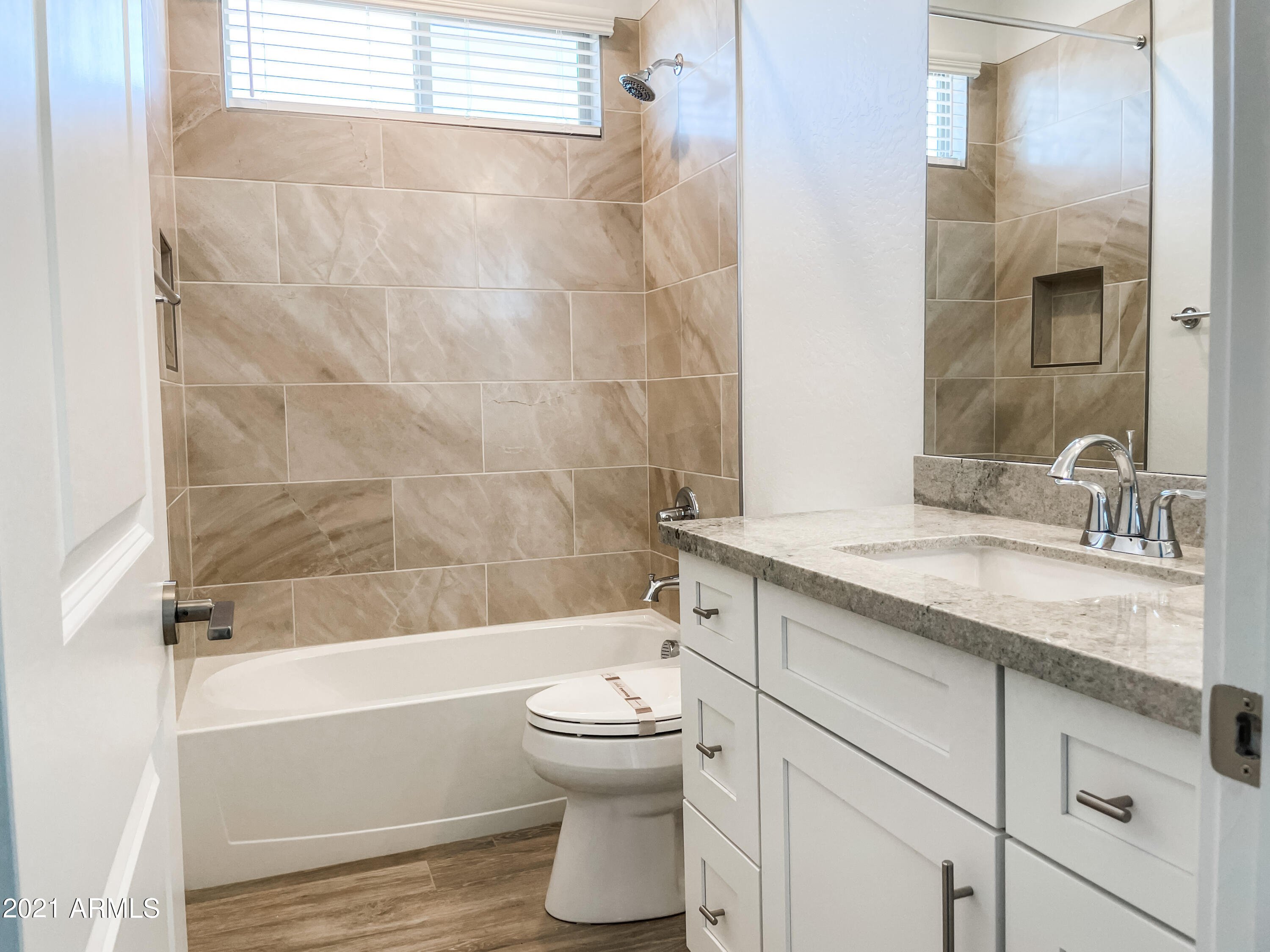 17009 East Bobwhite Way Rio Verde, AZ 85263 - Photo 5 of 12 a bathroom with a granite countertop toilet a sink and bathtub