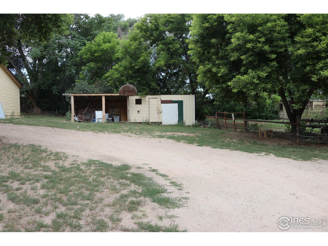 2235 5th Street Greeley, CO 80631 - Photo 13 of 21 a backyard of a house with garage and outdoor seating