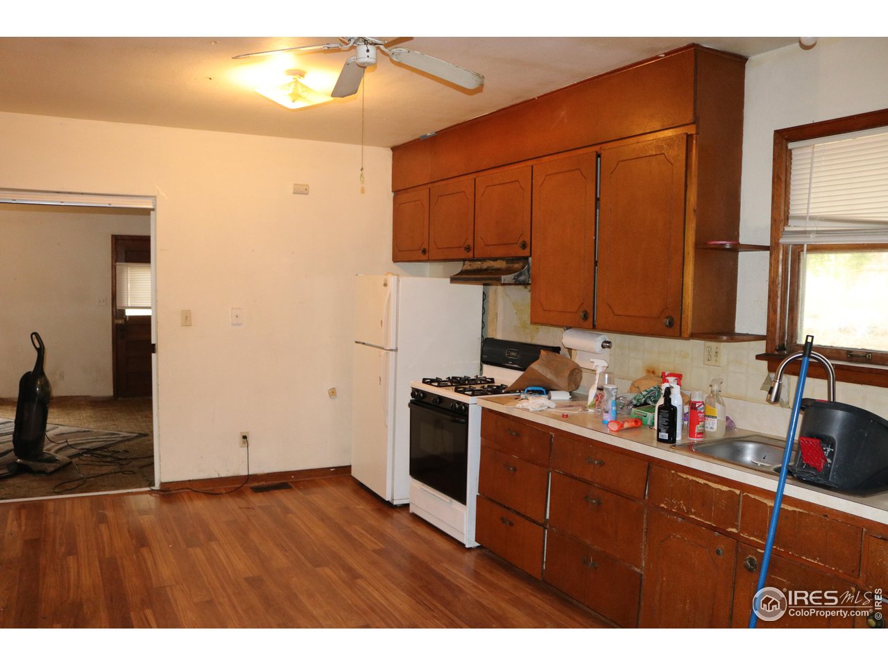 2235 5th Street Greeley, CO 80631 - Photo 8 of 21 a kitchen with stainless steel appliances granite countertop a sink stove and cabinets