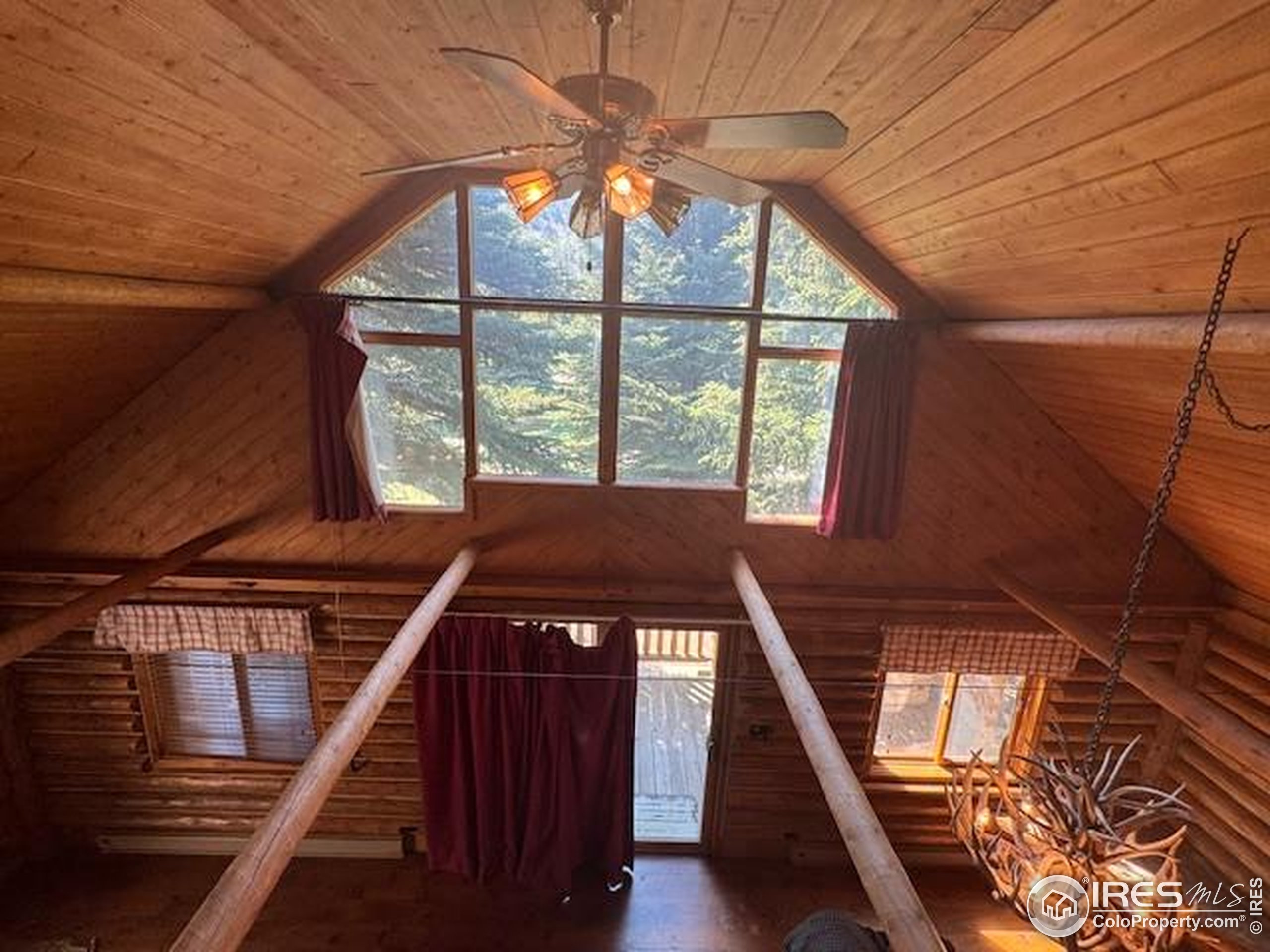 110 Meadow Lane Bellvue, CO 80512 - Photo 13 of 28 a view of an empty room with a window