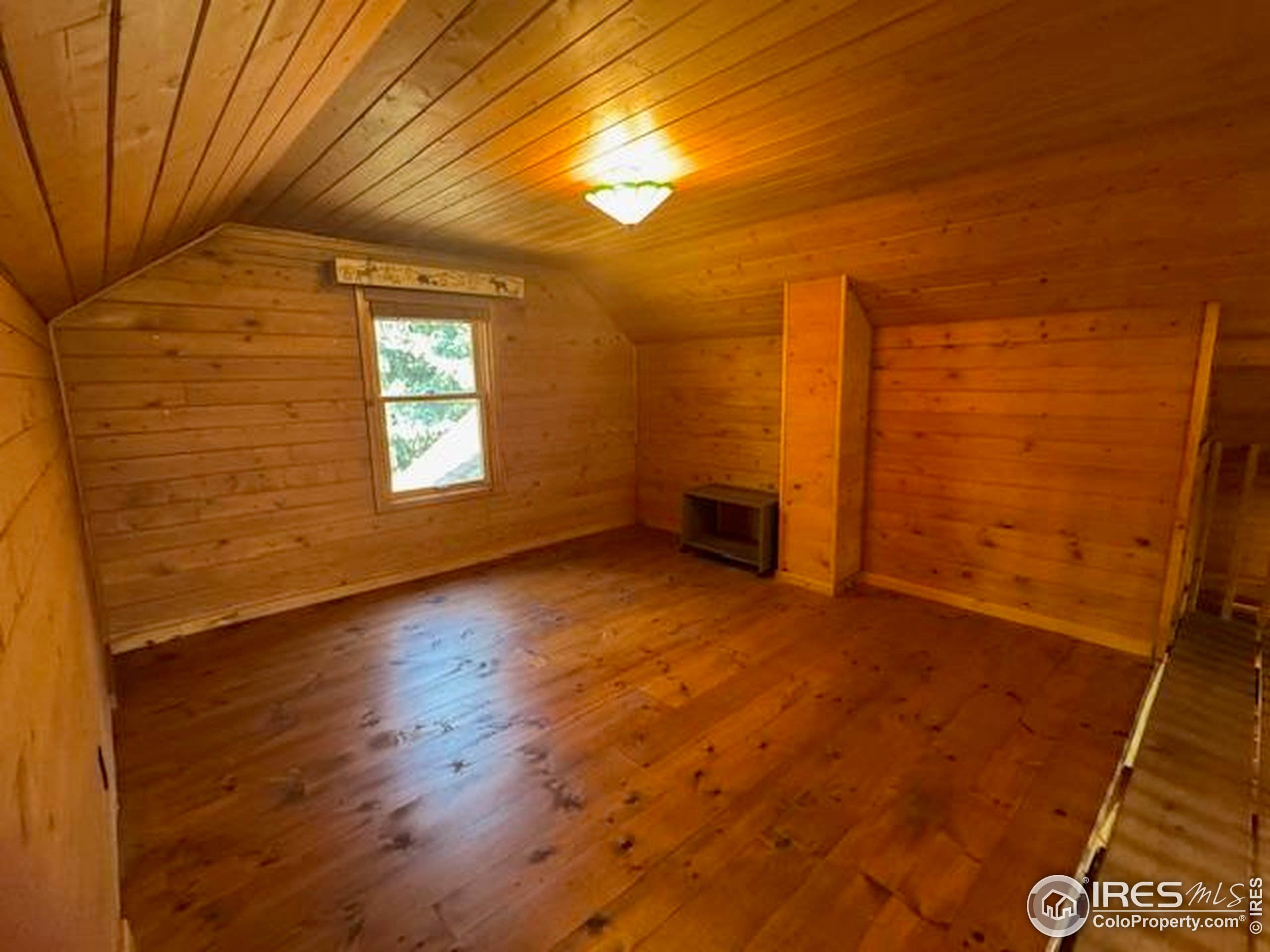 110 Meadow Lane Bellvue, CO 80512 - Photo 14 of 28 a view of empty room with windows