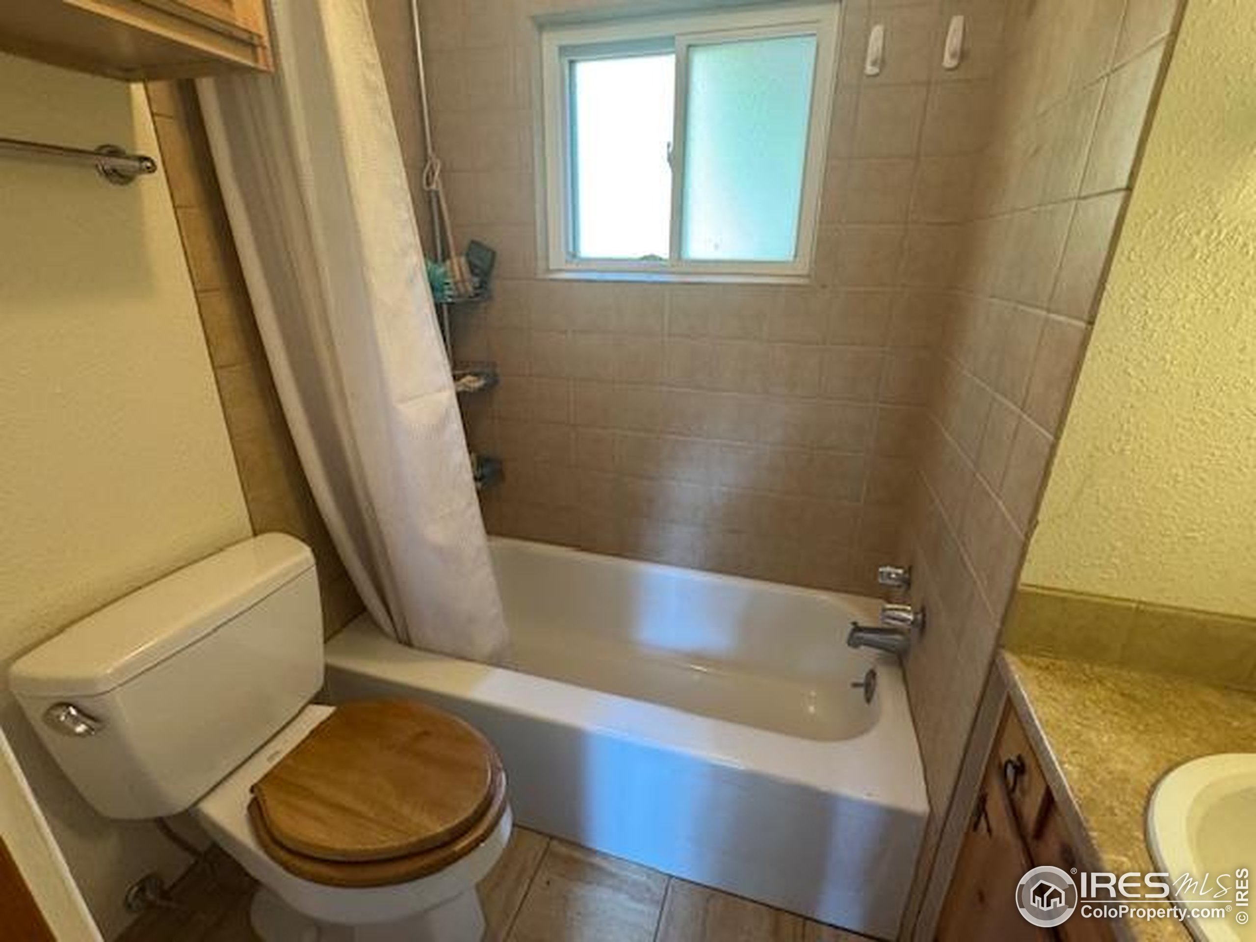110 Meadow Lane Bellvue, CO 80512 - Photo 16 of 28 a bathroom with a sink and a tub