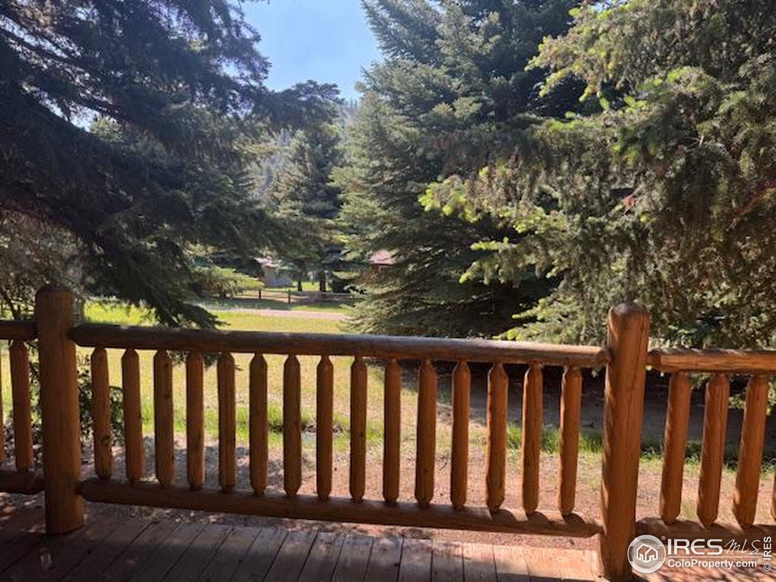 110 Meadow Lane Bellvue, CO 80512 - Photo 17 of 28 a view of a wooden deck