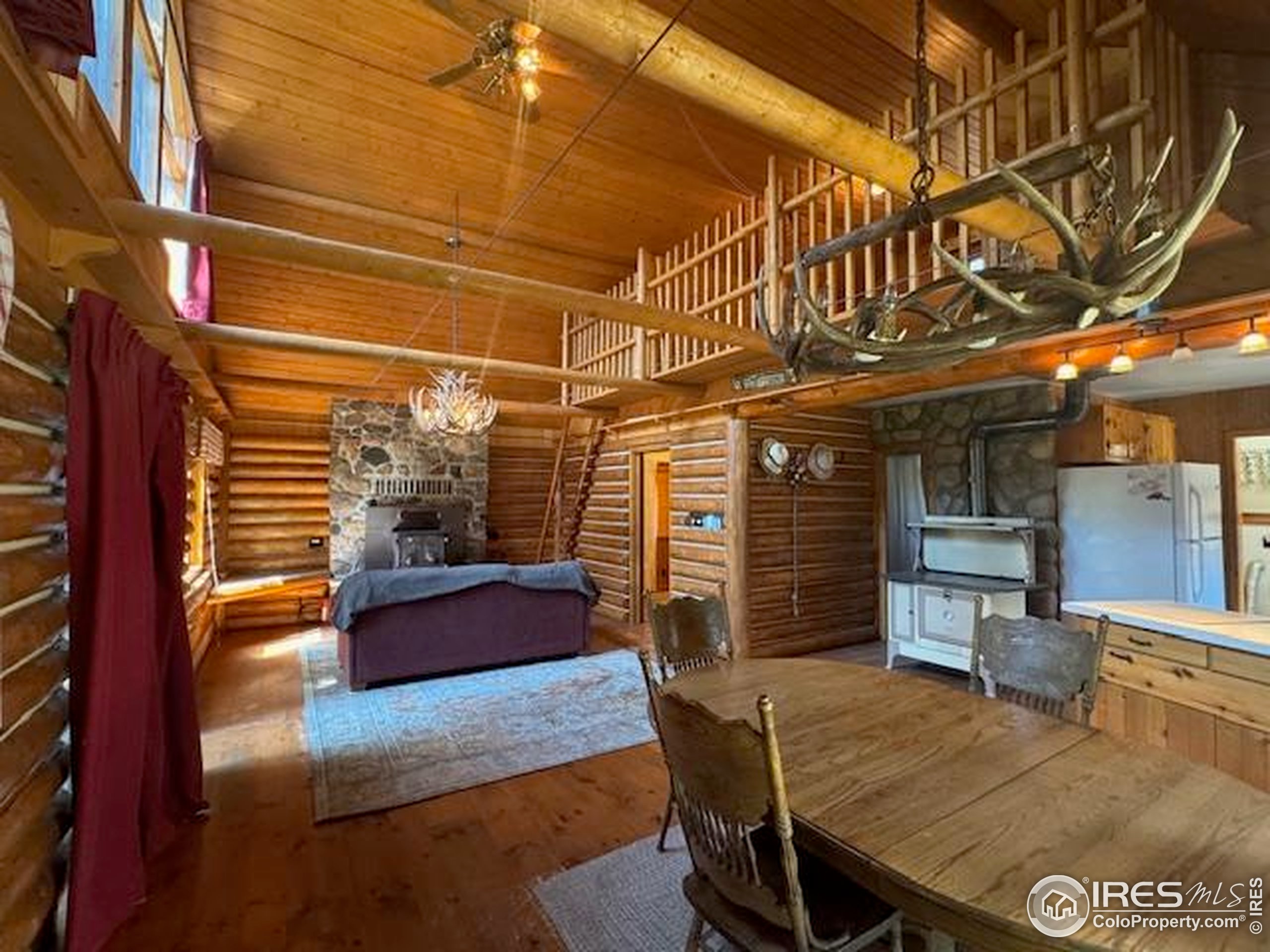 110 Meadow Lane Bellvue, CO 80512 - Photo 2 of 28 a view of a chairs and table in the patio