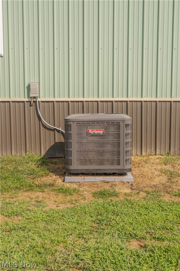 5267 Apollo Road Northeast Salineville, OH 43945 - Photo 25 of 33 Exterior view of a central AC unit