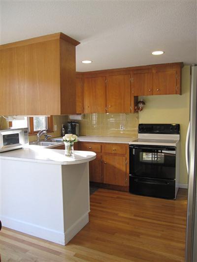 10 Crowell Road Sandwich, MA 02563 - Photo 2 of 13 a kitchen with a sink and a stove top oven
