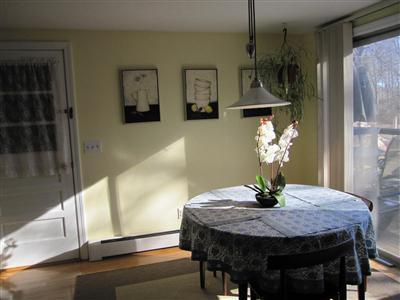 10 Crowell Road Sandwich, MA 02563 - Photo 3 of 13 a view of a dining room with furniture and wooden floor