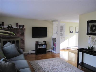 10 Crowell Road Sandwich, MA 02563 - Photo 4 of 13 a living room with furniture and a flat screen tv