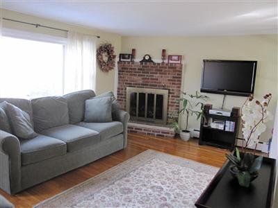 10 Crowell Road Sandwich, MA 02563 - Photo 5 of 13 a living room with furniture and a flat screen tv