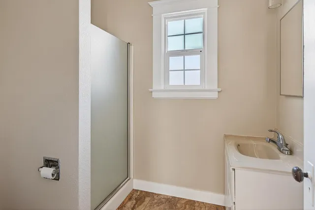 a bathroom with a sink and window