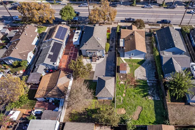 an aerial view of houses with trees