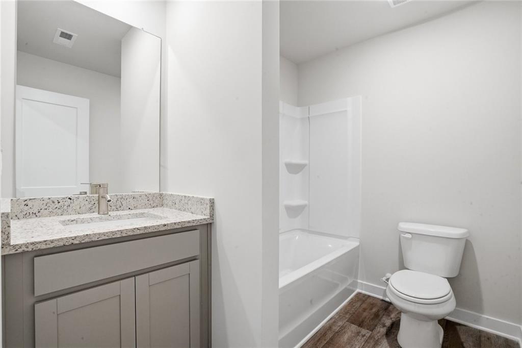 5351 Tolar Road South Fulton, GA 30213 - Photo 24 of 30 a bathroom with a sink toilet vanity and bathtub