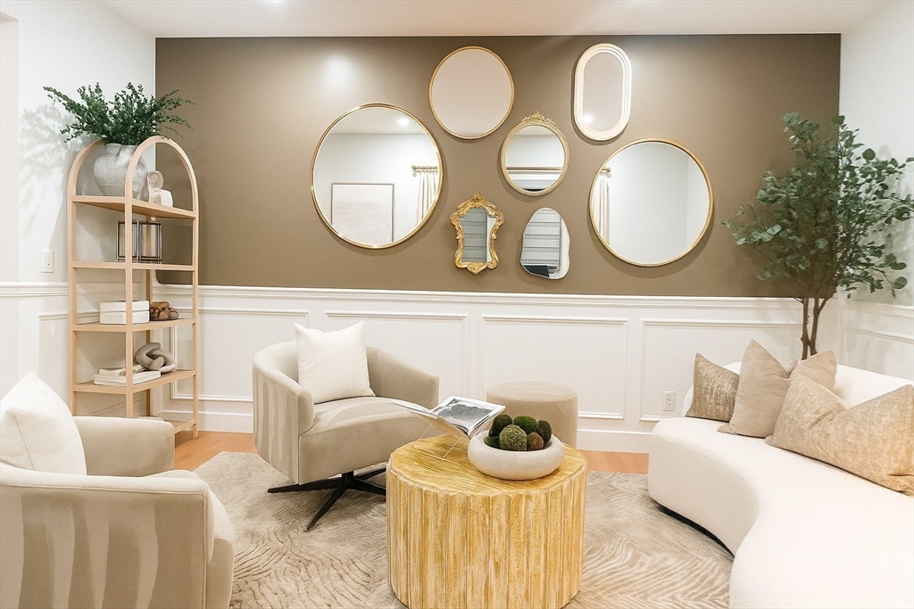 6 Rivendell Lane Millis, MA 02054 - Photo 14 of 33 a living room with furniture and a mirror
