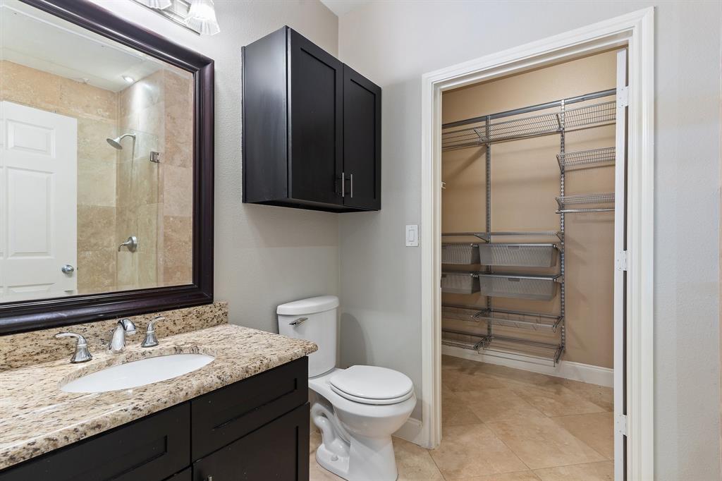 3102 Kings Road, Unit 1106 Dallas, TX 75219 - Photo 10 of 20 a bathroom with a granite countertop sink toilet and shower
