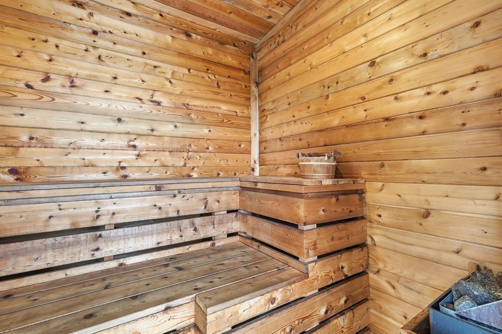 7751 Faught Road Northlake, TX 76226 - Photo 29 of 39 Custom sauna featuring natural wood paneling, multi-level slatted benches, and a dedicated sauna heater
