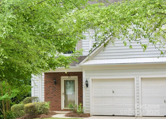 a view of a house with a tree