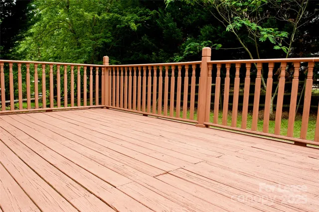 a balcony with wooden floor