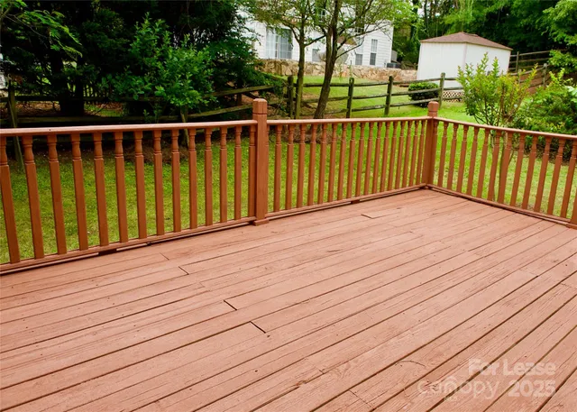 a balcony with wooden floor