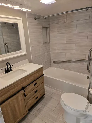 a bathroom with a sink a toilet and a bathtub