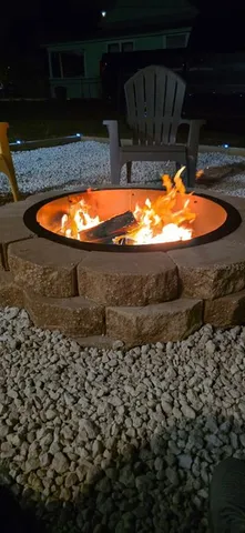 a view of swimming pool with outdoor seating and plants