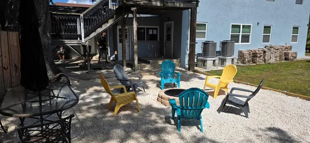 a view of swimming pool with sitting area