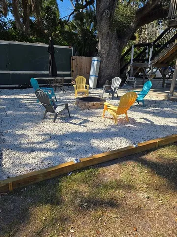 a view of a room that has wooden floor and a window