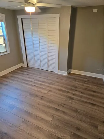 a kitchen with stainless steel appliances granite countertop a refrigerator a sink and a stove