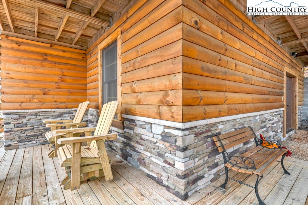 3043 Junaluska Road Boone, NC 28607 - Photo 41 of 49 a view of a patio with a table and chairs