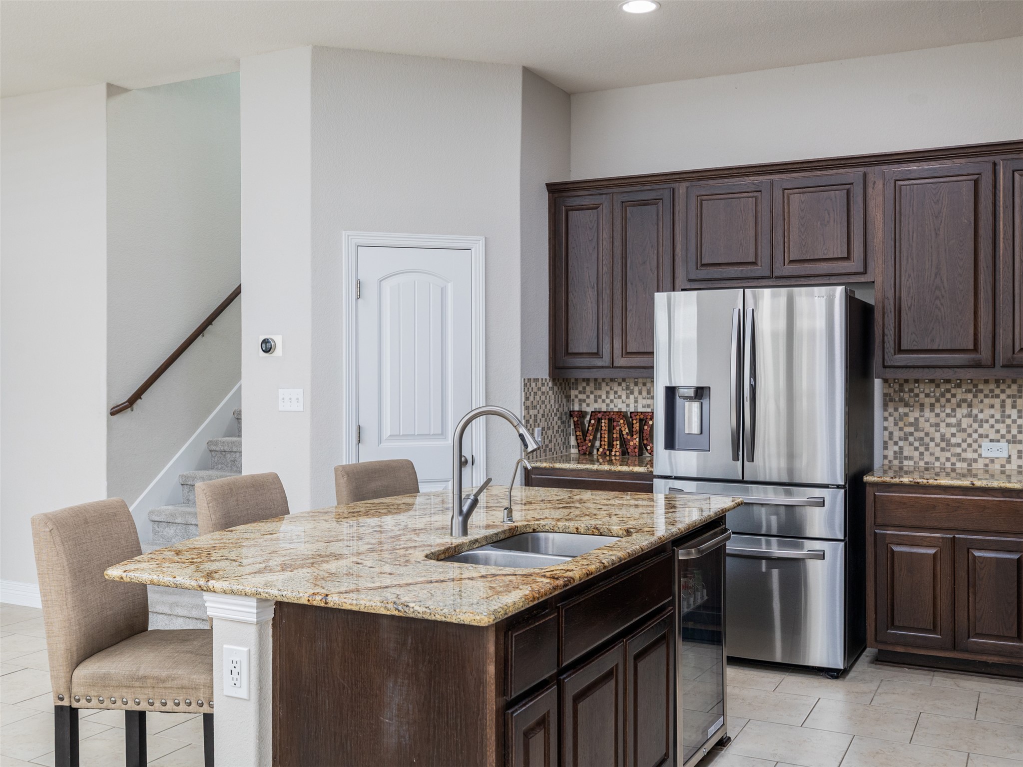 717 Blue Agave Lane Georgetown, TX 78626 - Photo 11 of 28 a kitchen with stainless steel appliances granite countertop a sink stove and refrigerator