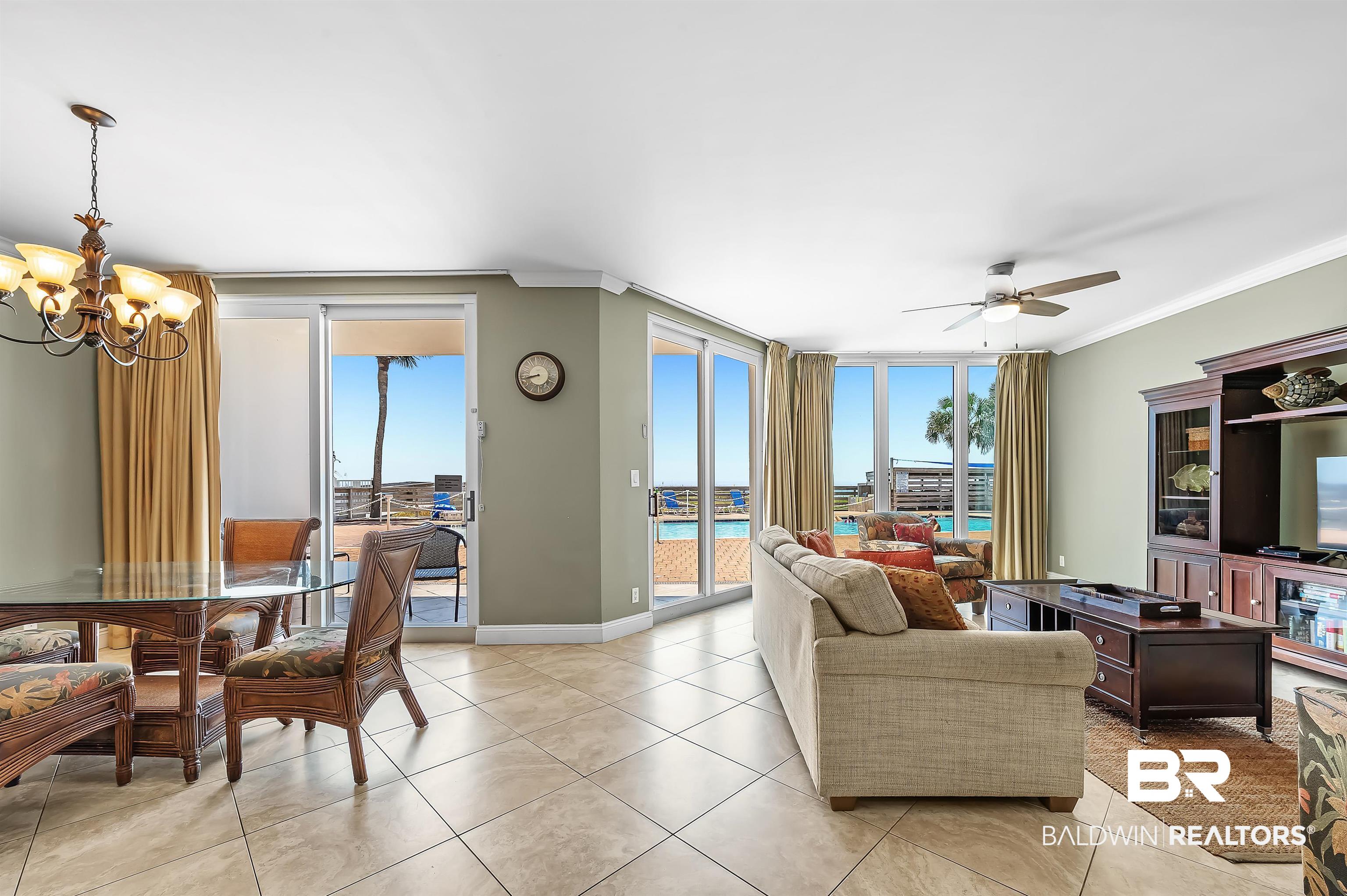 16287 Perdido Key Drive, Unit 105 Pensacola, FL 32507 - Photo 10 of 66 Tiled flooring throughout with expansive sliding glass doors and windows
