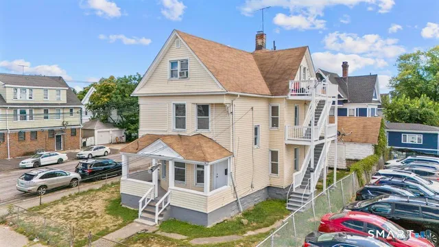 a aerial view of a house with swimming pool and sitting area