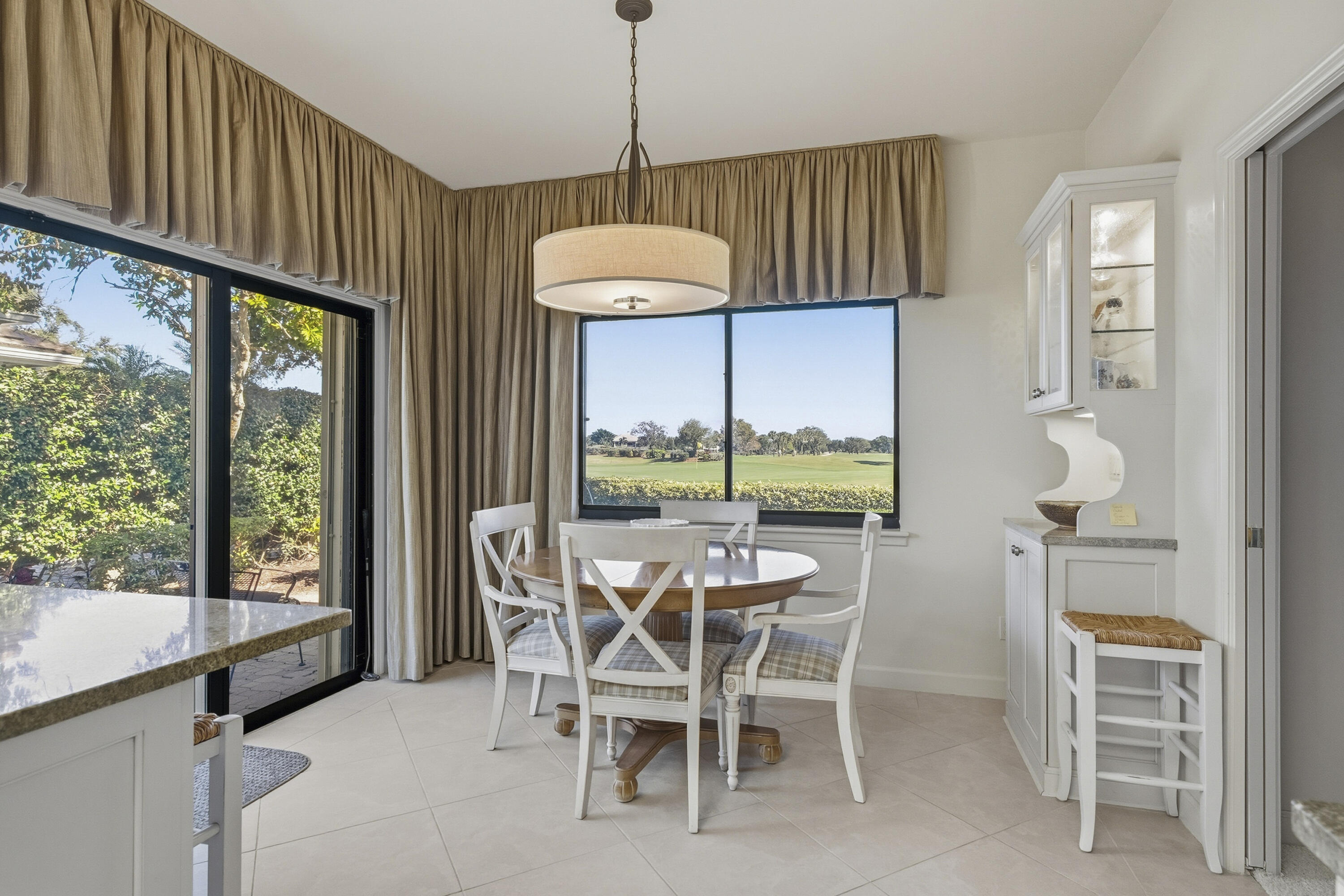 6997 Southeast Pacific Drive Stuart, FL 34997 - Photo 15 of 57 a dining room with furniture and window