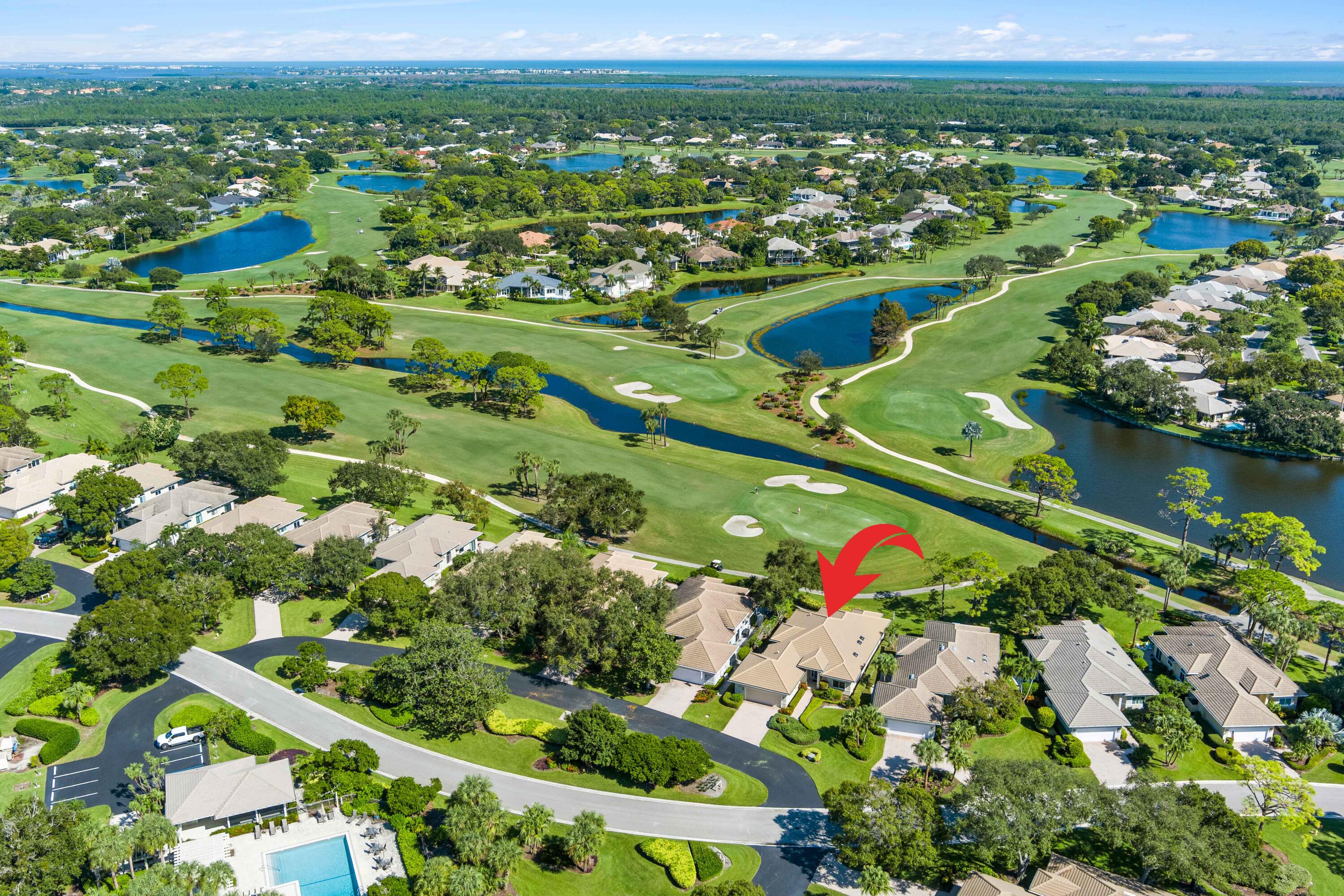 6997 Southeast Pacific Drive Stuart, FL 34997 - Photo 2 of 57 a view of a city with a lake