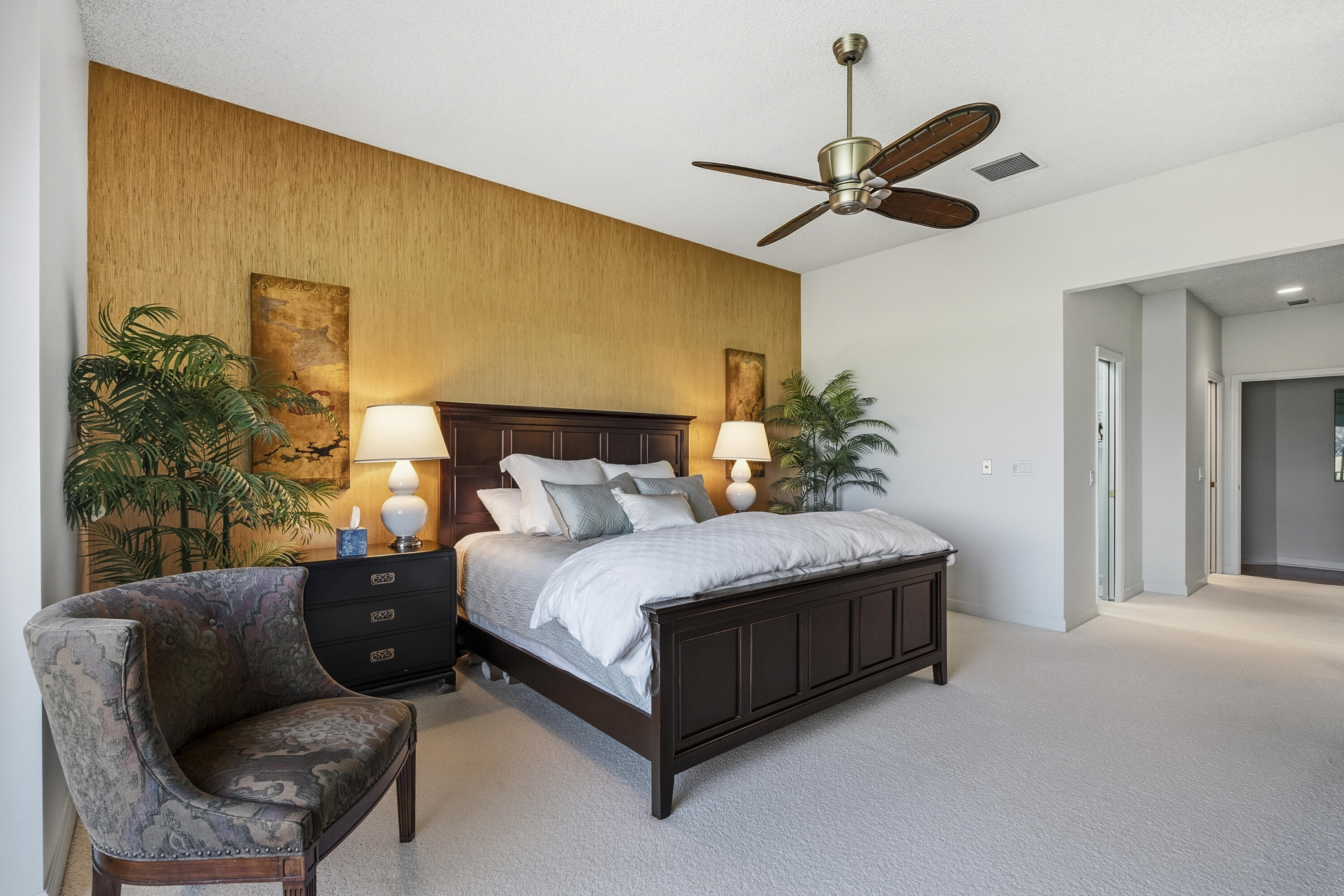6997 Southeast Pacific Drive Stuart, FL 34997 - Photo 21 of 57 a bedroom with a bed couch chandelier and a window