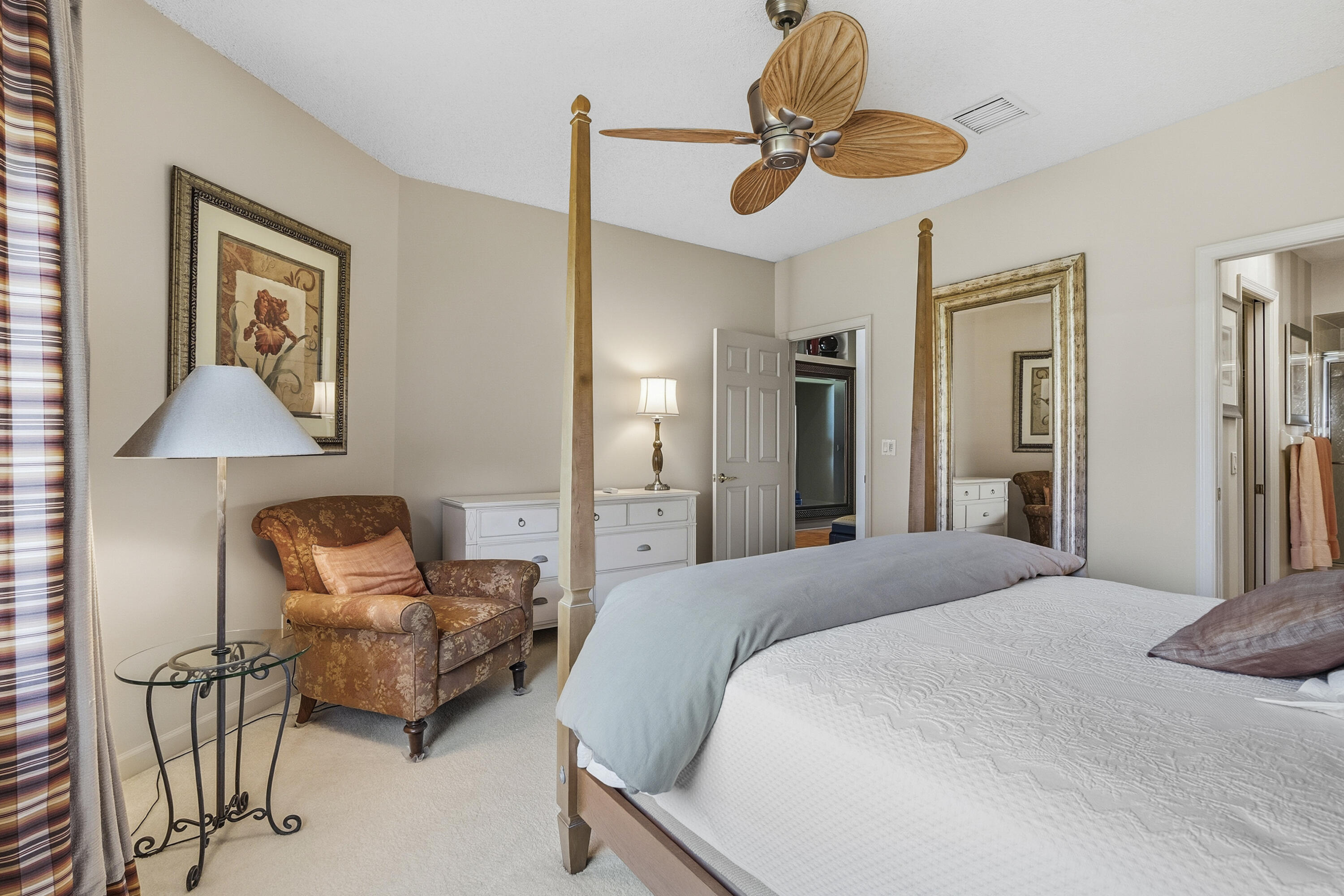 6997 Southeast Pacific Drive Stuart, FL 34997 - Photo 27 of 57 a bedroom with furniture and a chandelier