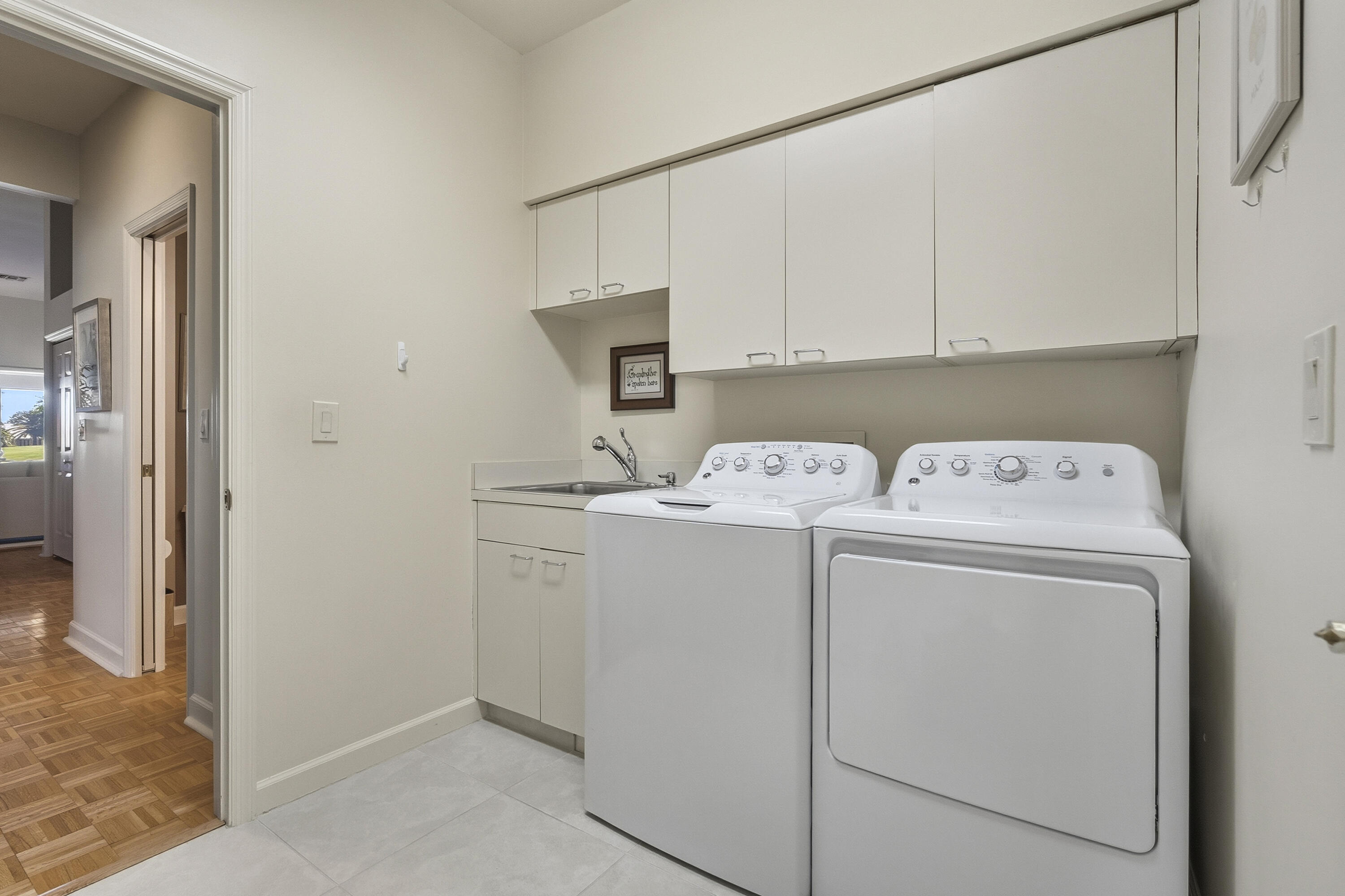 6997 Southeast Pacific Drive Stuart, FL 34997 - Photo 31 of 57 a utility room with dryer and washer