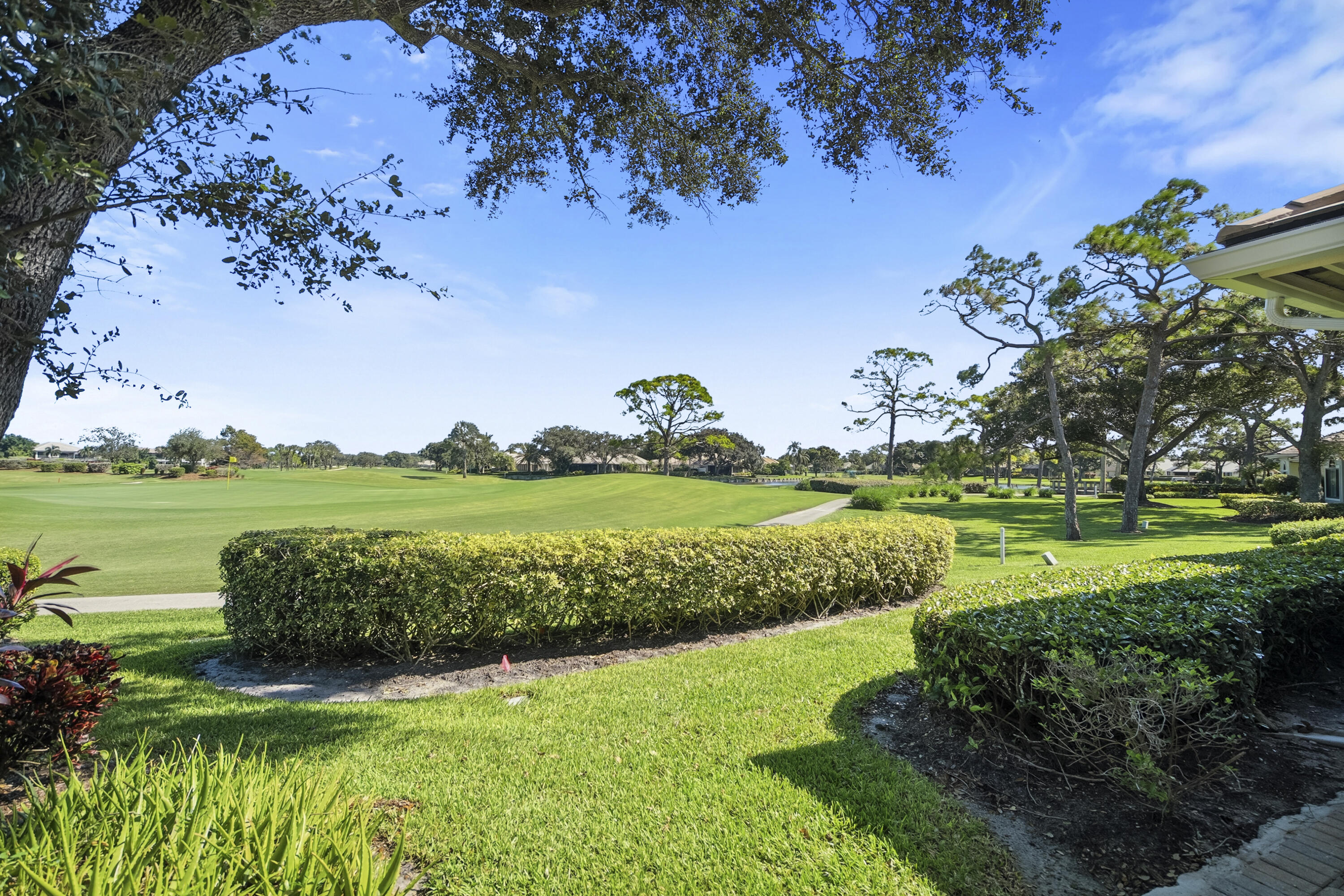 6997 Southeast Pacific Drive Stuart, FL 34997 - Photo 36 of 57 a view of a golf course with a lake