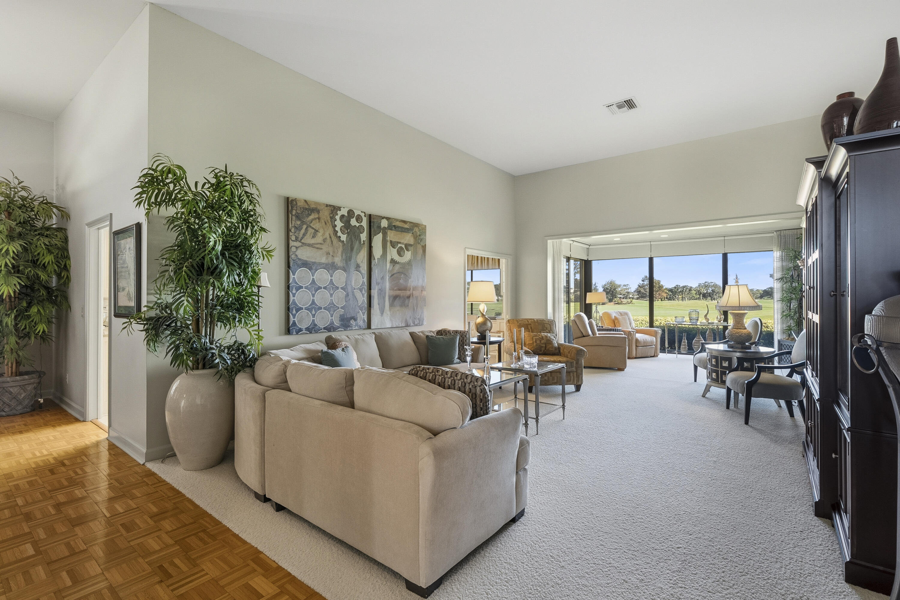 6997 Southeast Pacific Drive Stuart, FL 34997 - Photo 6 of 57 a living room with furniture and a large window