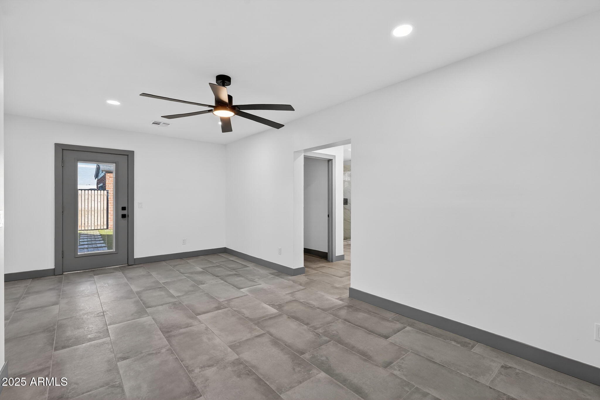 3241 North 27th Place Phoenix, AZ 85016 - Photo 15 of 25 a view of empty room with ceiling fan