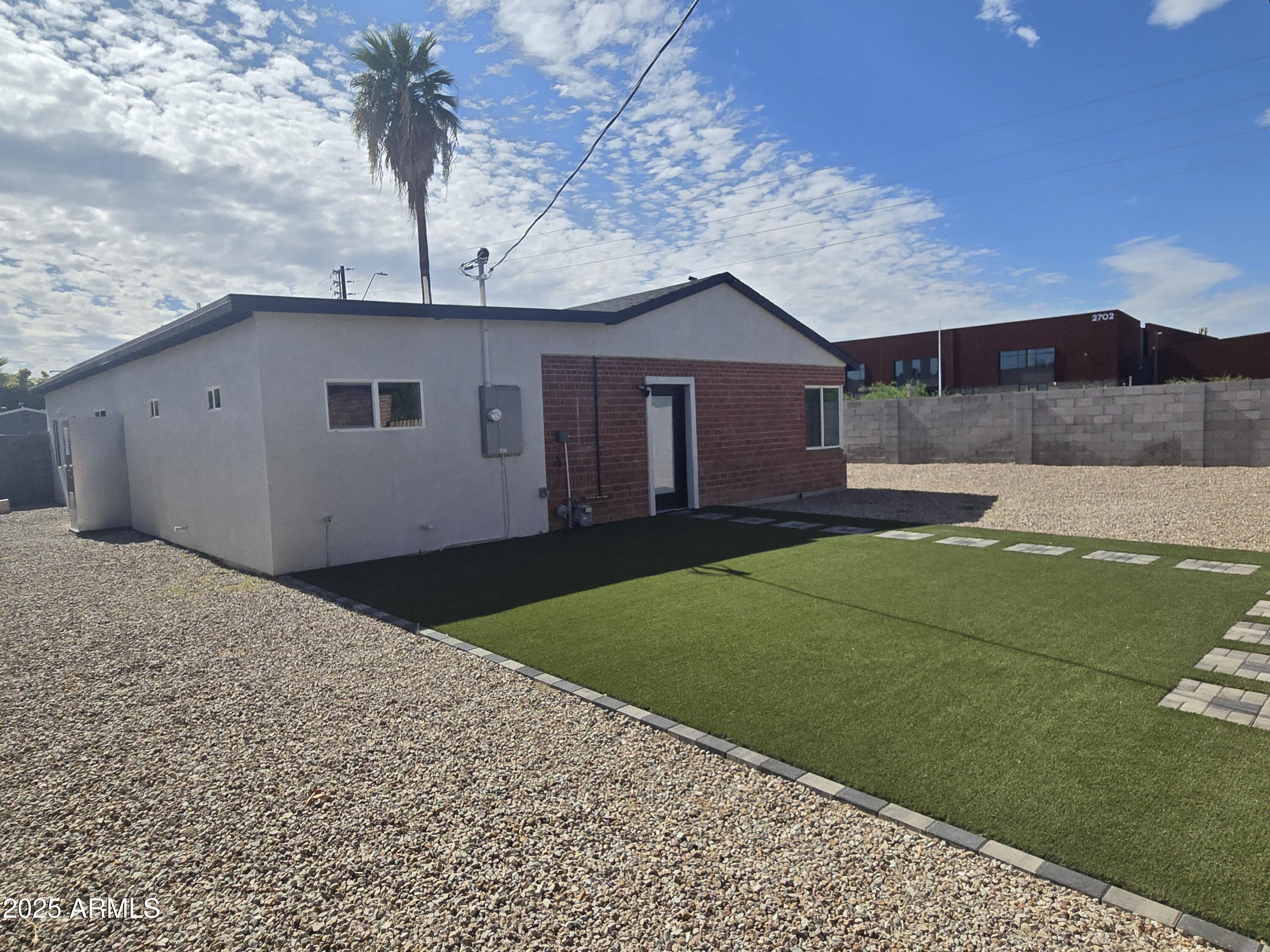 3241 North 27th Place Phoenix, AZ 85016 - Photo 8 of 25 a house view with a backyard space
